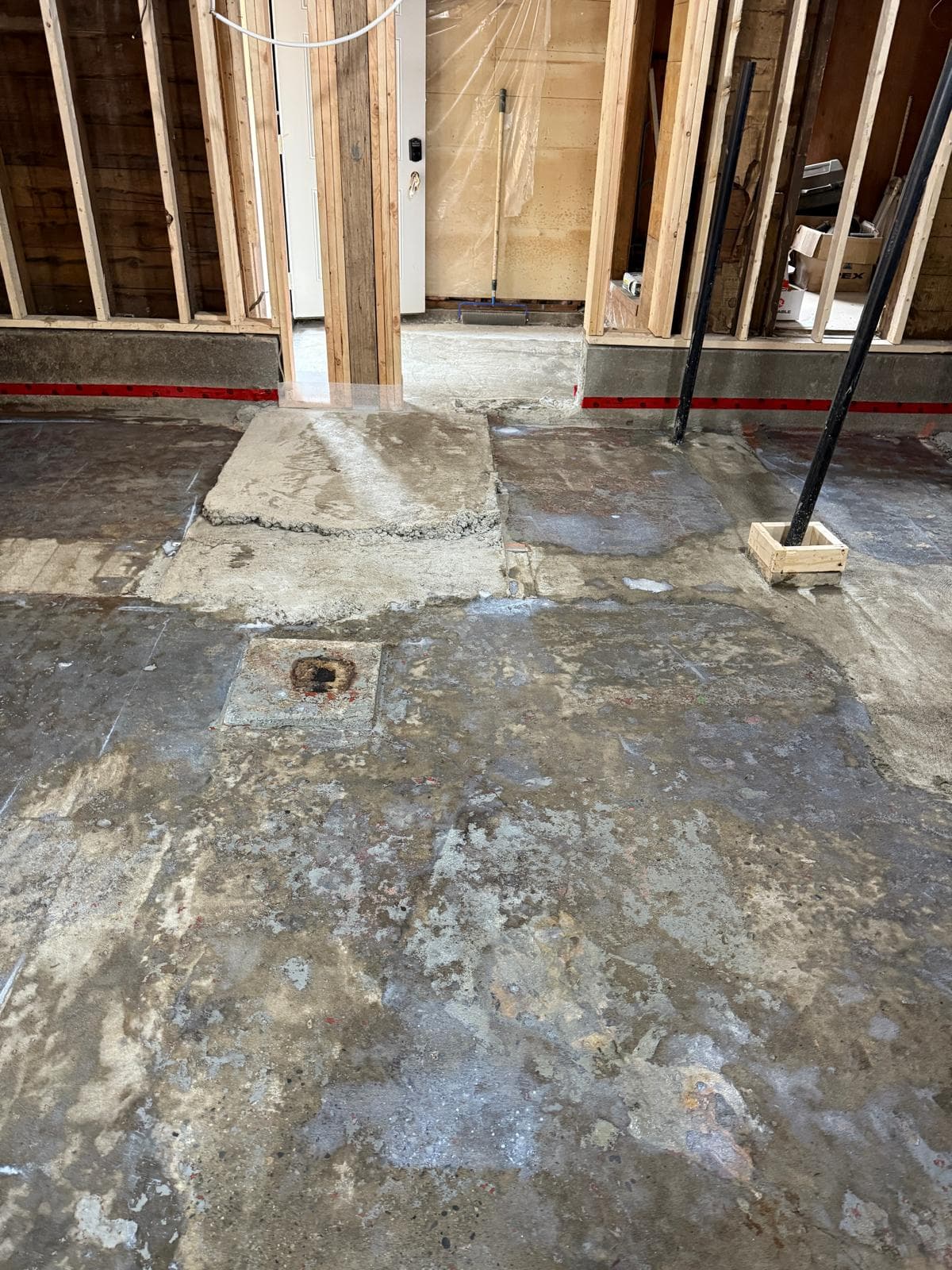 Slab cut out for footings & plumbing — before