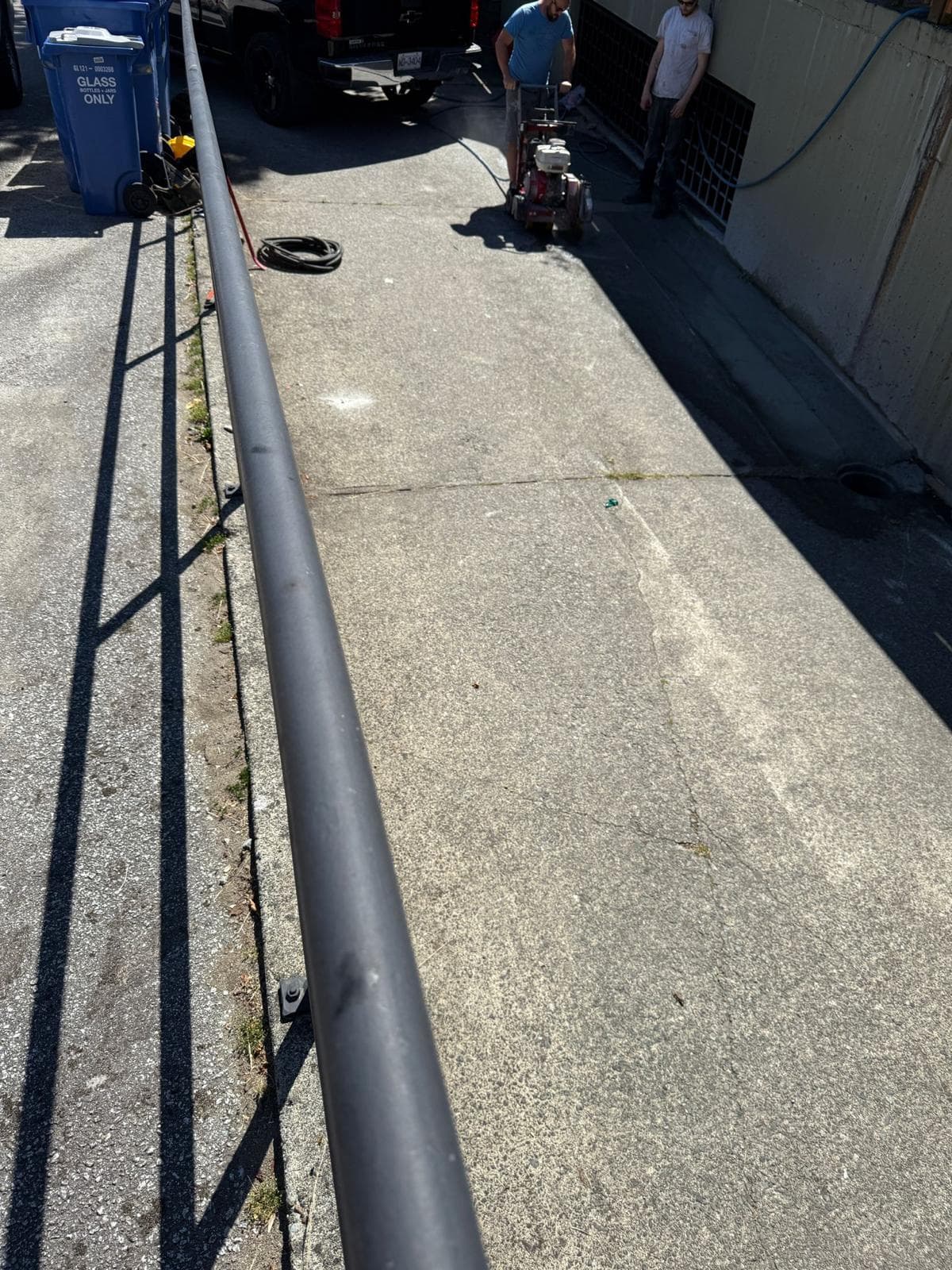 Parkade driveway removed, rebar set — before