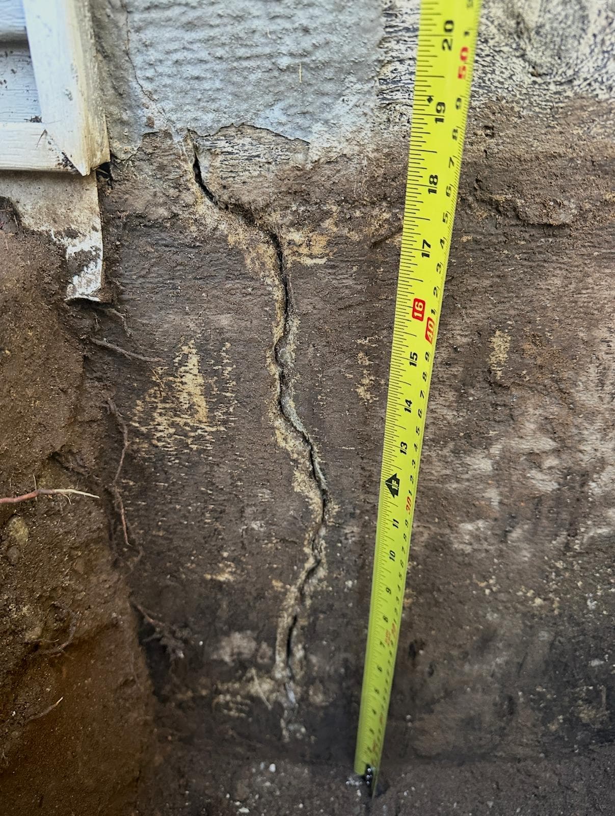 Exposed foundation crack, measured — before