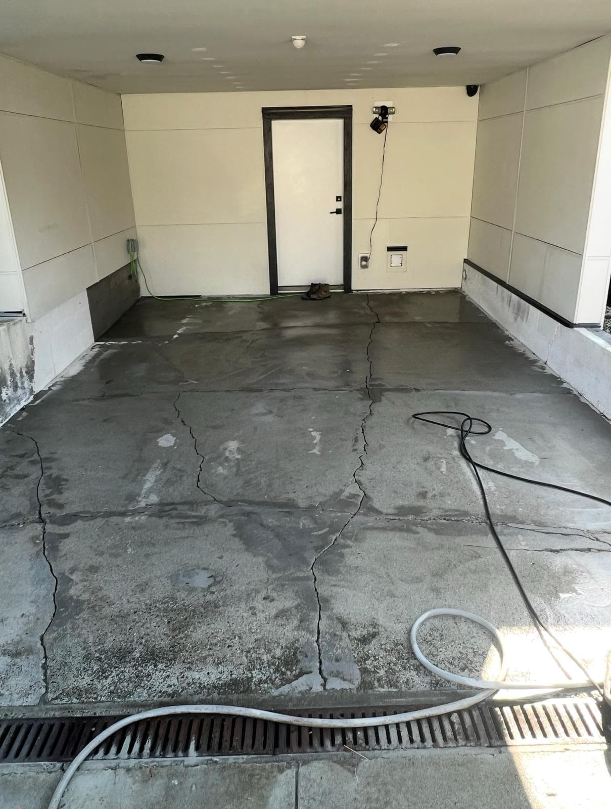 Cracked parkade stall slab — before