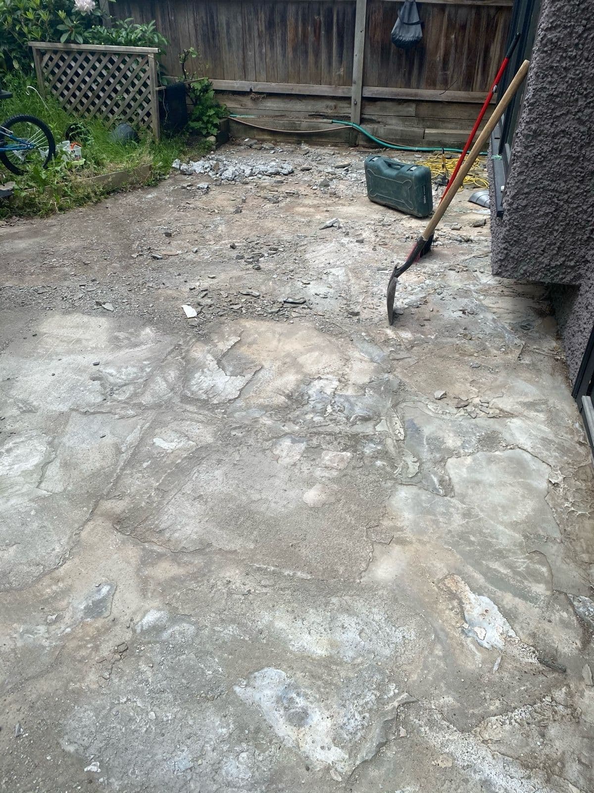 Old concrete patio slab demolished and removed before renovation