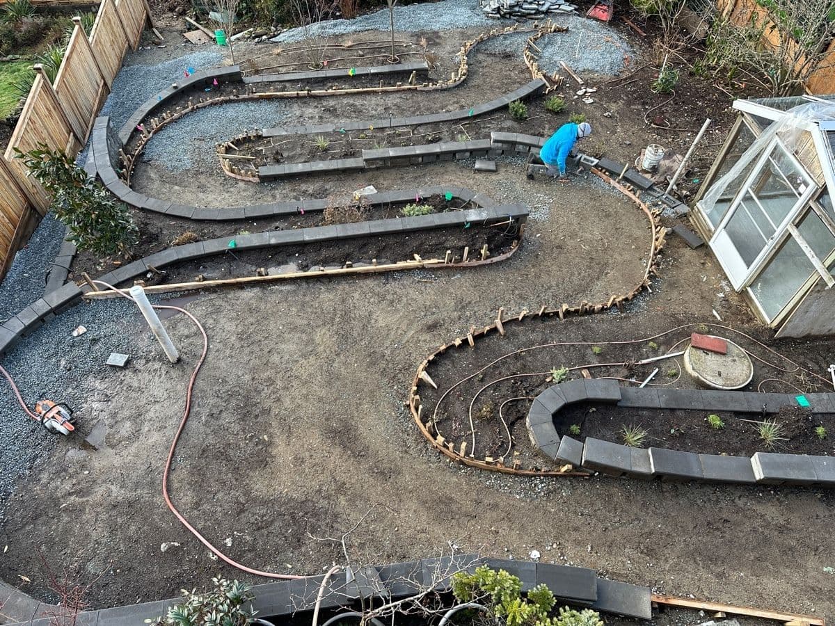 Aerial view of curved garden retaining walls under construction