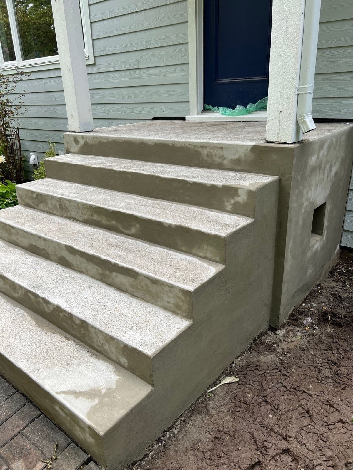 Freshly resurfaced front entrance concrete steps